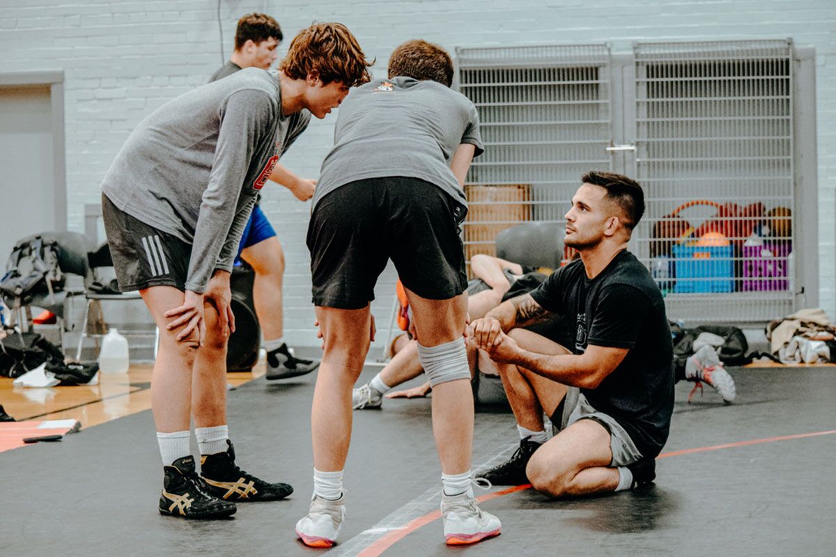 kd6 wrestling buffalo ny coach instructing two wrestlers